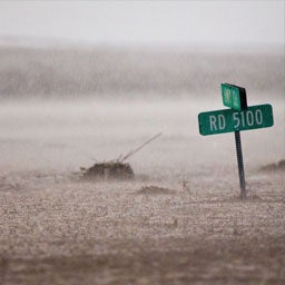 Flooded street and street sign