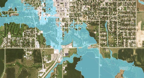 arial view of land with a blue flood area marked over the top