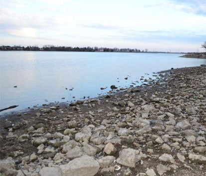 view of small lake or pond and rocks